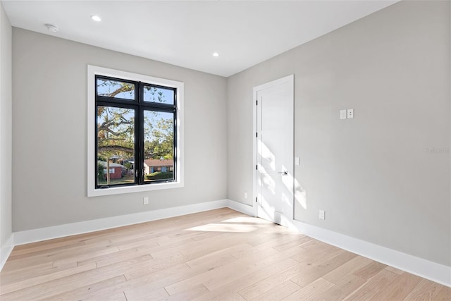 spare room with light hardwood / wood-style floors