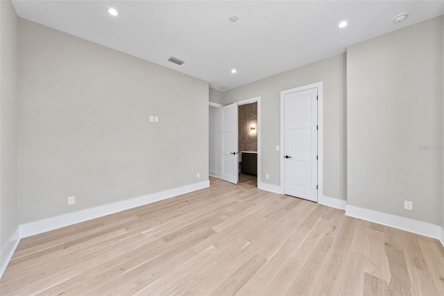 unfurnished bedroom featuring light wood-type flooring