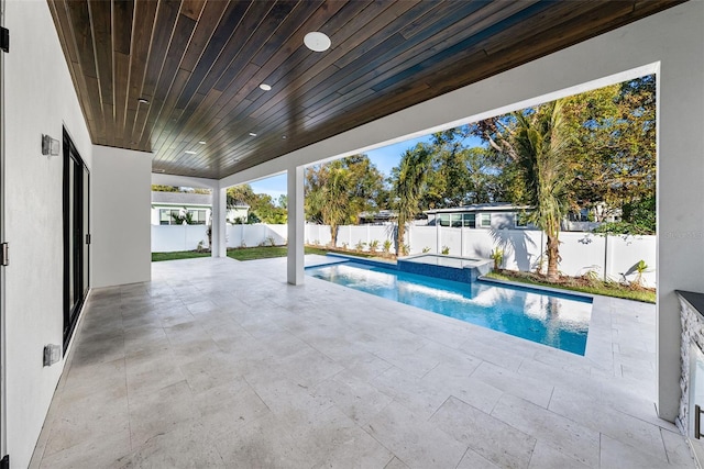 view of swimming pool with a patio and pool water feature