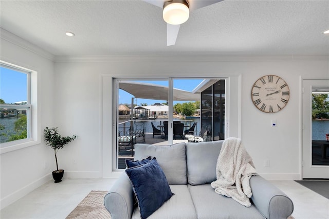 living room with a healthy amount of sunlight and a textured ceiling