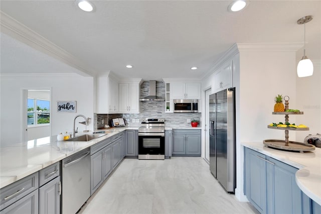 kitchen featuring white cabinetry, hanging light fixtures, stainless steel appliances, and sink