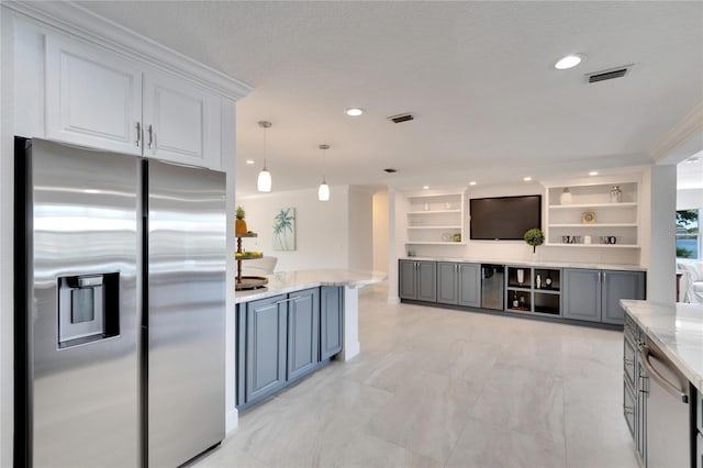 kitchen featuring stainless steel refrigerator with ice dispenser, crown molding, pendant lighting, built in features, and white cabinets