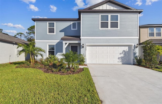 front facade featuring a front yard and a garage