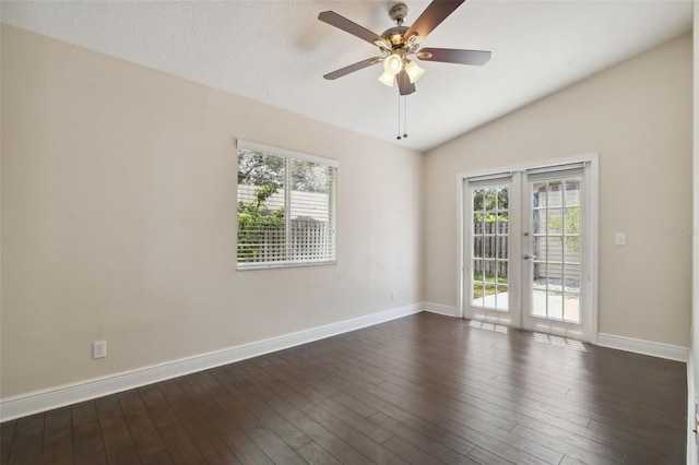 unfurnished room featuring dark hardwood / wood-style floors, ceiling fan, lofted ceiling, and a wealth of natural light