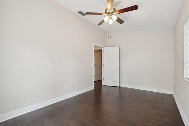 unfurnished room featuring vaulted ceiling, ceiling fan, and dark hardwood / wood-style floors