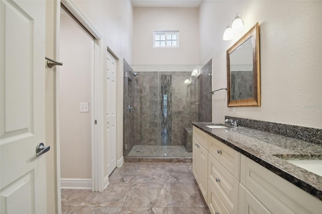 bathroom with vanity and a shower with shower door