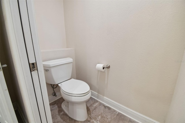 bathroom featuring toilet