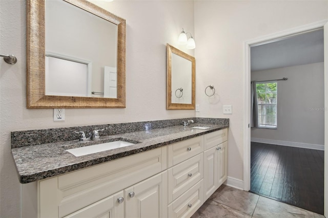 bathroom featuring hardwood / wood-style flooring and vanity