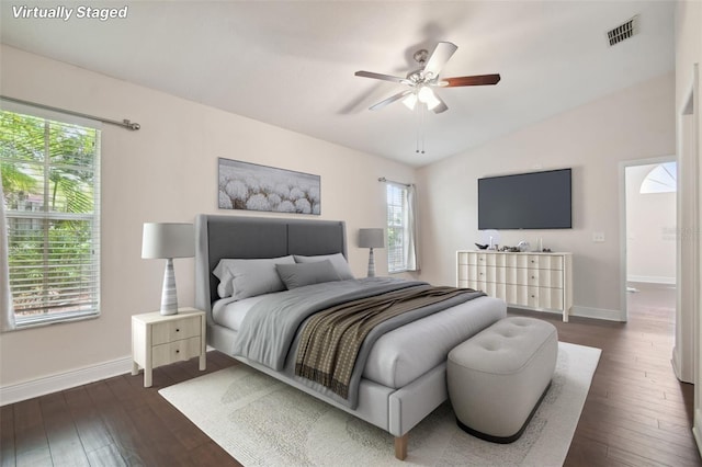 bedroom featuring vaulted ceiling, ceiling fan, and dark hardwood / wood-style floors