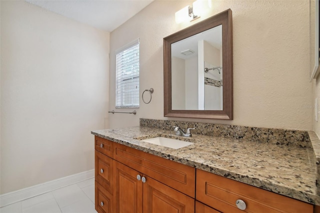 bathroom featuring tile patterned floors and vanity