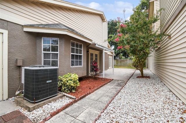 exterior space featuring a patio and cooling unit