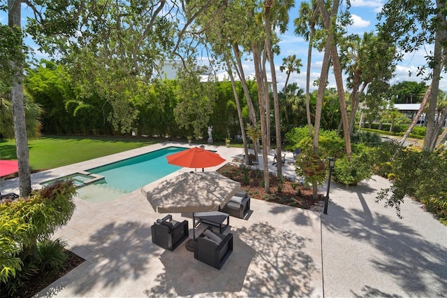 view of swimming pool with a lawn, a patio area, and an in ground hot tub