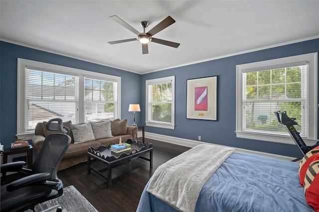 bedroom with ceiling fan, dark wood-type flooring, and multiple windows