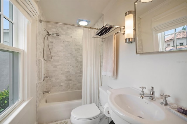 full bathroom with sink, shower / bath combo, and toilet