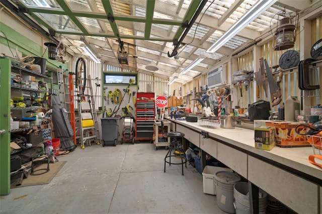 garage featuring a workshop area and a garage door opener