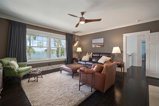 living room featuring dark hardwood / wood-style flooring, ceiling fan, a water view, and ornamental molding