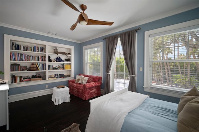 bedroom featuring multiple windows, ceiling fan, hardwood / wood-style floors, and crown molding