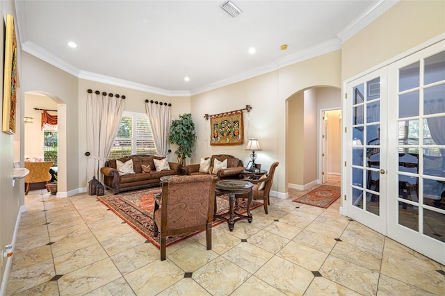 living room with french doors and ornamental molding