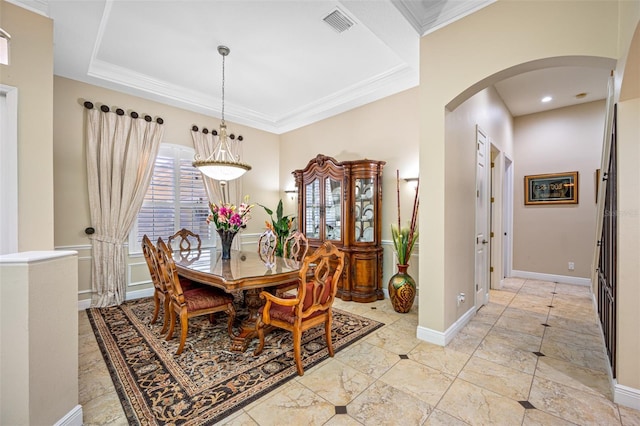 1227 Toscano Dr, Trinity, FL 34655 - dining space with arched walkways, ornamental molding, and baseboards