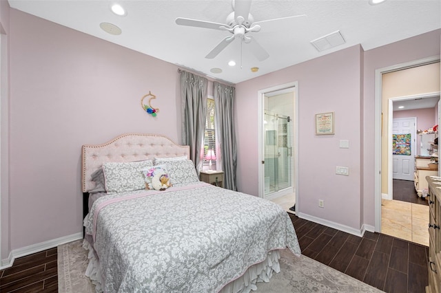 1227 Toscano Dr, Trinity, FL 34655 - bedroom featuring wood tiled floors, baseboards, recessed lighting, ceiling fan, and ensuite bath