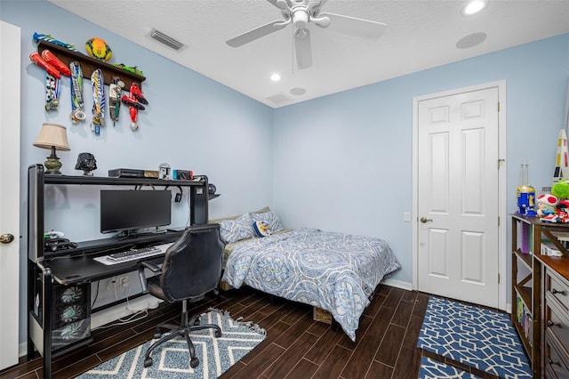 1227 Toscano Dr, Trinity, FL 34655 - bedroom featuring wood finish floors, an office area, ceiling fan, baseboards, and recessed lighting