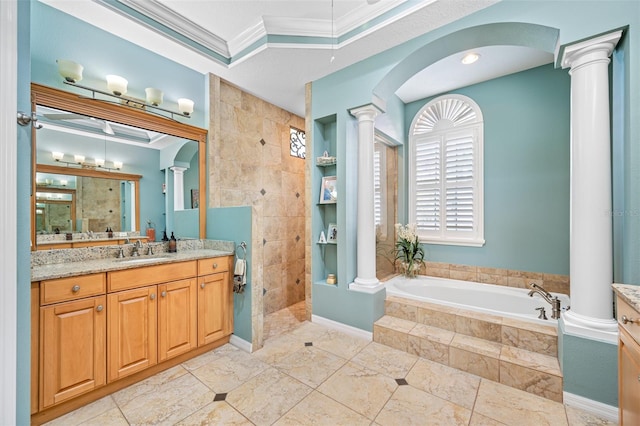 1227 Toscano Dr, Trinity, FL 34655 - bathroom featuring ornate columns, crown molding, vanity, a garden tub, and walk in shower