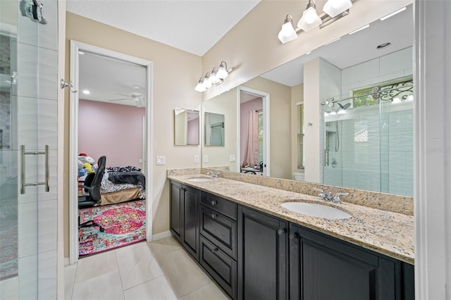 1227 Toscano Dr, Trinity, FL 34655 - full bath featuring double vanity, a shower stall, ceiling fan, and ensuite bath