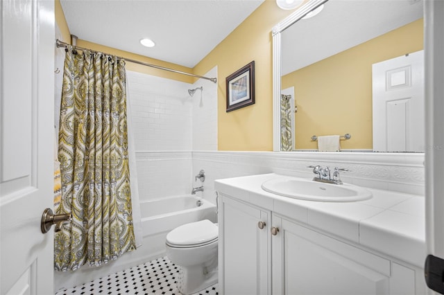 full bathroom with vanity, shower / bathtub combination with curtain, and toilet