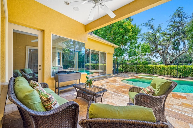 view of patio / terrace with ceiling fan, an outdoor hangout area, and a pool with hot tub