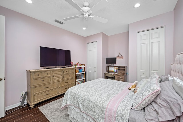 1227 Toscano Dr, Trinity, FL 34655 - bedroom featuring multiple closets, wood finish floors, baseboards, recessed lighting, and a ceiling fan