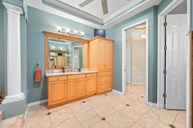 bathroom with vanity, crown molding, ceiling fan, a textured ceiling, and decorative columns