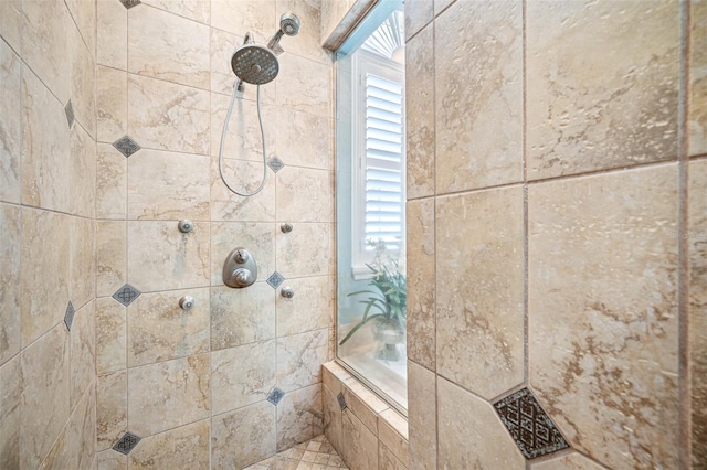 bathroom with a tile shower