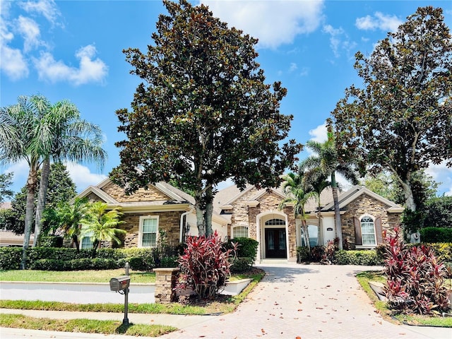1227 Toscano Dr, Trinity, FL 34655 - view of front facade with stone siding