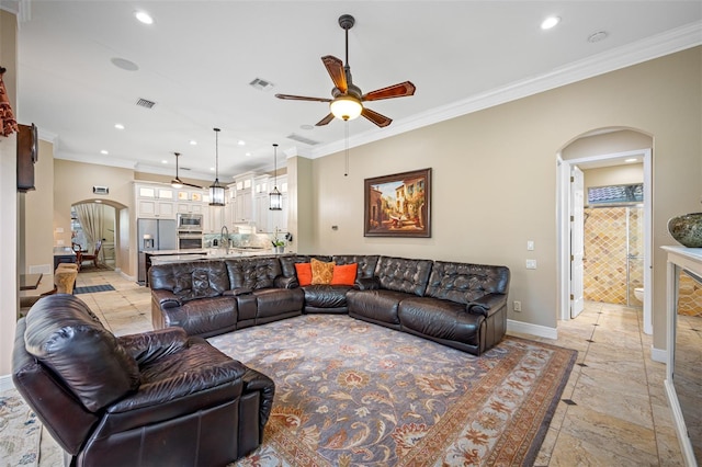 1227 Toscano Dr, Trinity, FL 34655 - living area featuring arched walkways, a ceiling fan, recessed lighting, baseboards, and ornamental molding