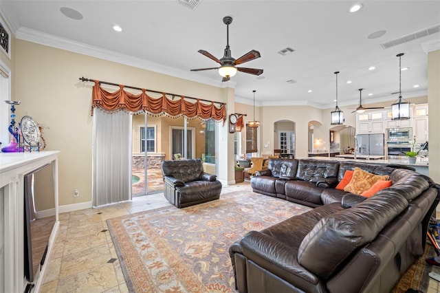 1227 Toscano Dr, Trinity, FL 34655 - living room featuring arched walkways, ceiling fan, recessed lighting, stone tile flooring, and baseboards