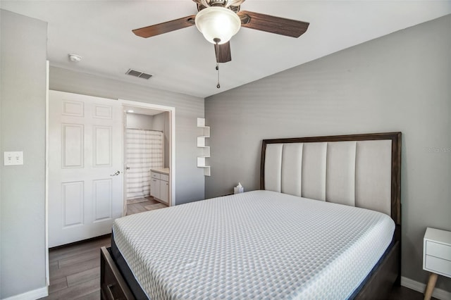 bedroom featuring wood-type flooring, connected bathroom, and ceiling fan