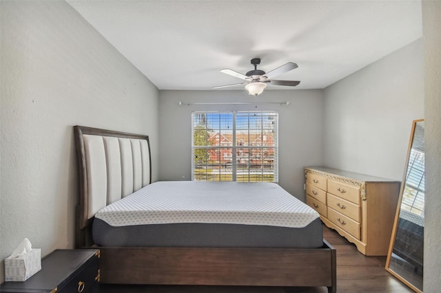 bedroom featuring dark hardwood / wood-style floors and ceiling fan