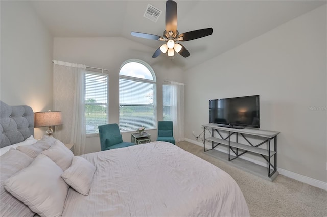 bedroom with ceiling fan, light carpet, and lofted ceiling