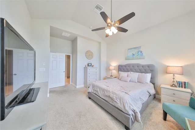 carpeted bedroom with ceiling fan and vaulted ceiling