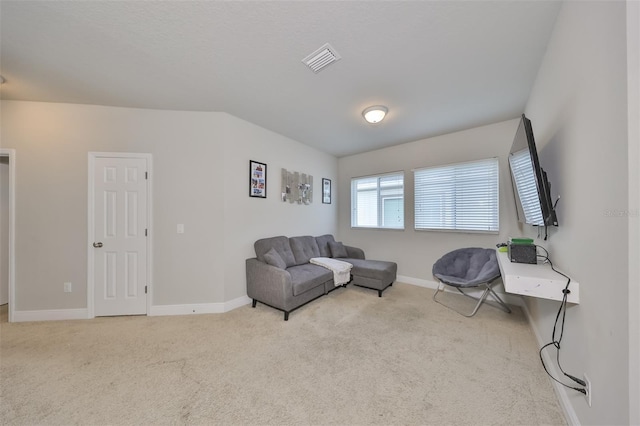 living area featuring light colored carpet