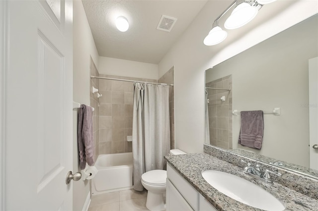 full bathroom with tile patterned flooring, shower / bath combination with curtain, a textured ceiling, toilet, and vanity