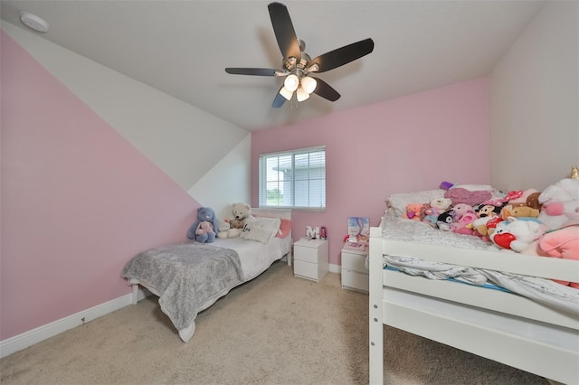 carpeted bedroom featuring ceiling fan and lofted ceiling