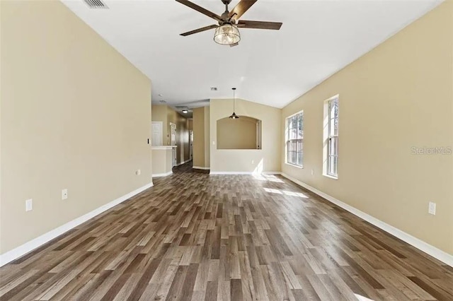 unfurnished living room with dark hardwood / wood-style flooring and ceiling fan