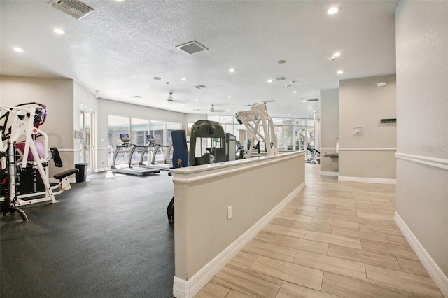 exercise room featuring a textured ceiling