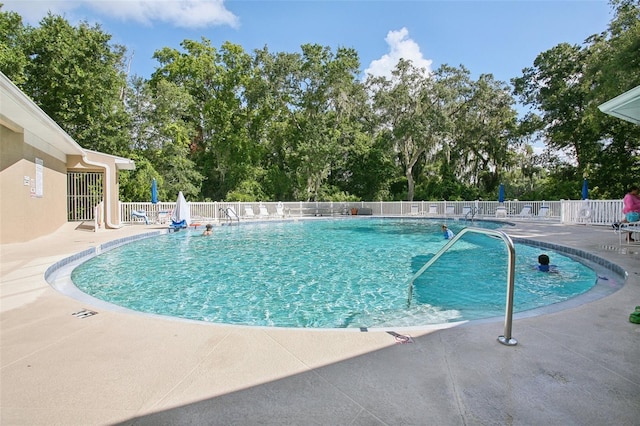 view of swimming pool featuring a patio area