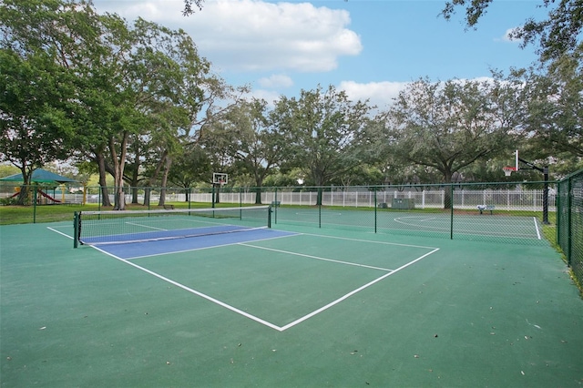 view of tennis court featuring basketball court