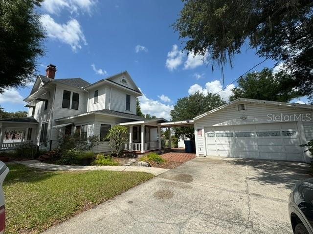 view of front of house with a garage and covered porch