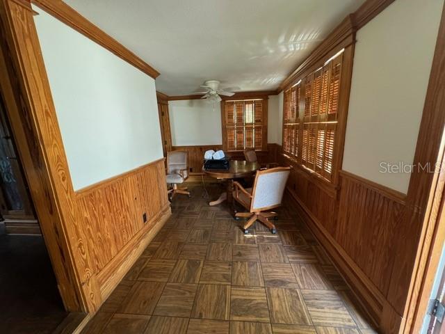 corridor with ornamental molding and parquet floors