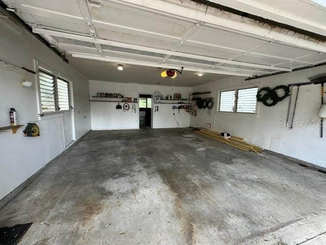 garage featuring a garage door opener