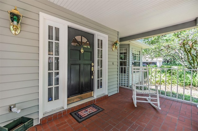 doorway to property featuring a porch